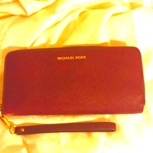 Michael Kors large Saffiano burgundy color leather accordion wallet/ wri…